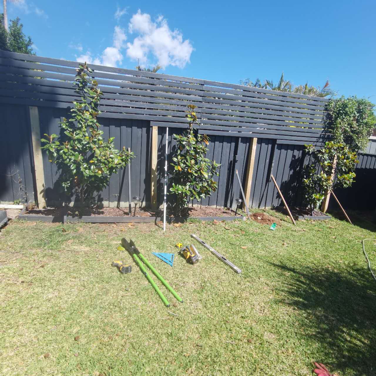 Timber fence construction in progress in a Melbourne backyard