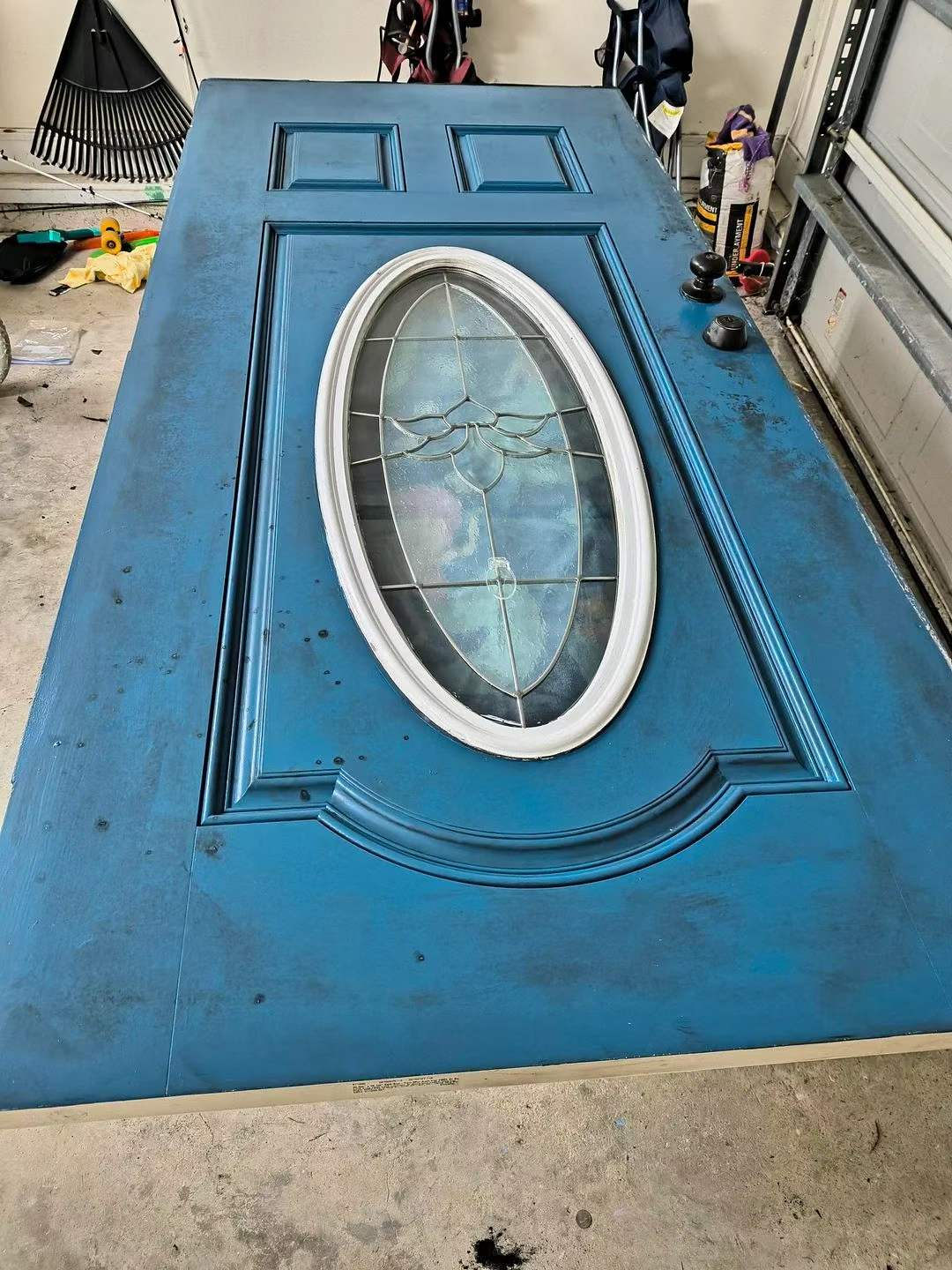 Weathered blue front door before restoration