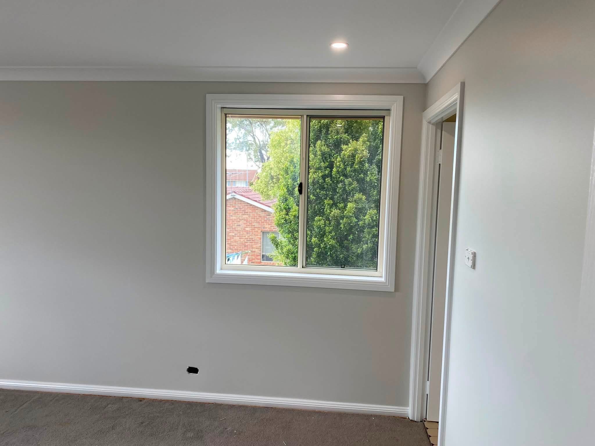 Finished interior timber window with light architrave