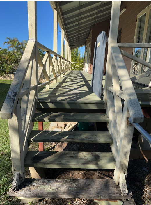 Timber verandah stairs and cross-braced balustrade